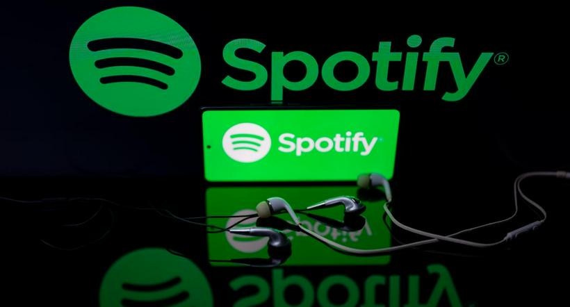 Spotify logo displayed on mobile with Spotify seen on screen in this photo illustration. on 29 January 2023 in Brussels, Belgium.  (Photo illustration by Jonathan Raa/NurPhoto)