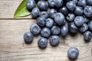 Close up of delicious blueberry on old table. This file is cleaned and retouched.