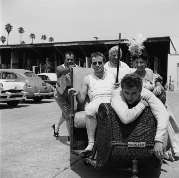 American actors James Dean (1931 - 1955, foreground) and Marlon Brando (1924 - 2004, centre) at Twentieth Century Fox studios, Los Angeles, California, 1954. Brando is playing Napoleon in Henry Koster's 'Desiree'. (Photo by Archive Photos/Getty Images)