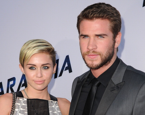 LOS ANGELES, CA - AUGUST 08: MIley Cyrus and Liam Hemsworth arrives at the "Paranoia" - Los Angeles Premiere at DGA Theater on August 8, 2013 in Los Angeles, California. (Photo by Steve Granitz/WireImage)