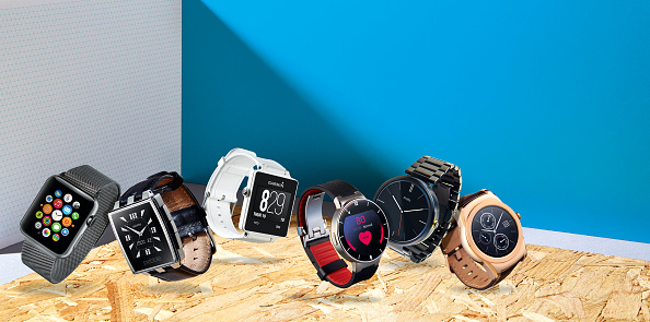 A selection of smart watches, including an Apple Watch, Pebble Steel, Garmin Vivoactive, Alcatel OneTouch, Motorola Moto 360 and an LG Urbane, taken on May 13, 2015. (Photo by Neil Godwin/T3 Magazine via Getty Images)