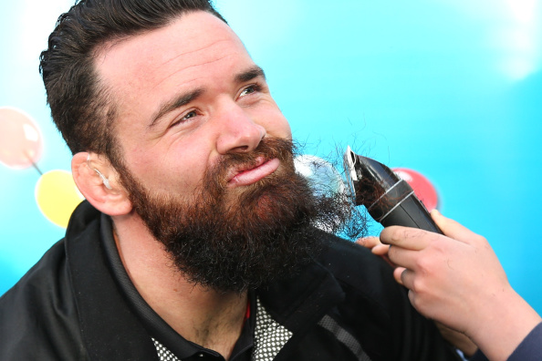 CHRISTCHURCH, NEW ZEALAND - SEPTEMBER 18: All Blacks and Crusaders rugby player Ryan Crotty has his shaved off for charity by Leni Smith on September 18, 2014 in Christchurch, New Zealand. Crotty who has been growing his Ned Kelly style beard for two years is shaving his beard in aid of raising money for the Child Cancer Foundation. (Photo by Martin Hunter/Getty Images)