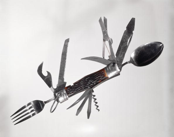 UNITED STATES - Circa 1960s: Retro Large Multi Tool Folding Pocket Knife Fork Spoon Scissors Saw Can Opener Corkscrew Screwdriver Awl. (Photo by H. Armstrong Roberts/Retrofile/Getty Images)