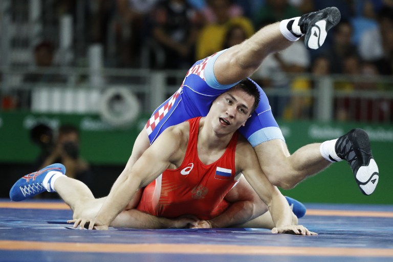 Lucha entre Roman Vlasov, de Rusia, y Bozo Starcevic, de Croacia. Pulzo.com