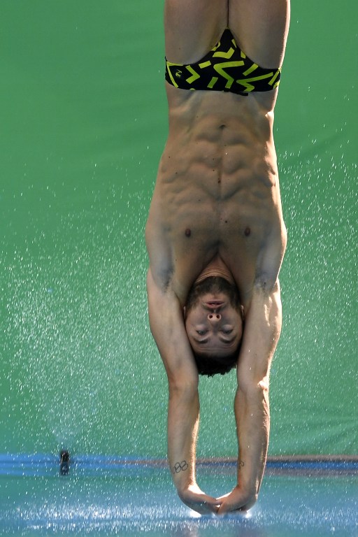 Italy's Michele Benedetti competes in the Men's 3m Springboard semifinal during the diving event at the Rio 2016 Olympic Games at the Maria Lenk Aquatics Stadium in Rio de Janeiro on August 16, 2016. / AFP PHOTO / CHRISTOPHE SIMON