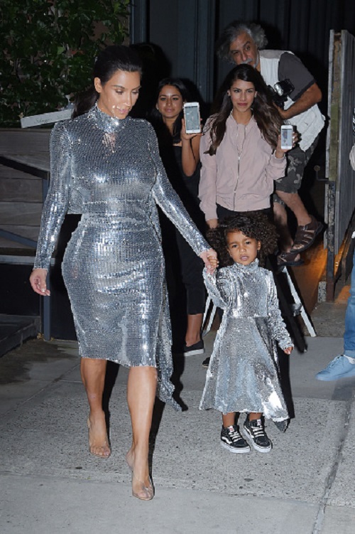 NEW YORK, NY - SEPTEMBER 05: Kim Kardashian and daughter North West seen leaving there Airbnb Apartment in Tribeca in a matching sequin dress on September 05, 2016 in New York, NY. (Photo by Josiah Kamau/BuzzFoto via Getty Images)