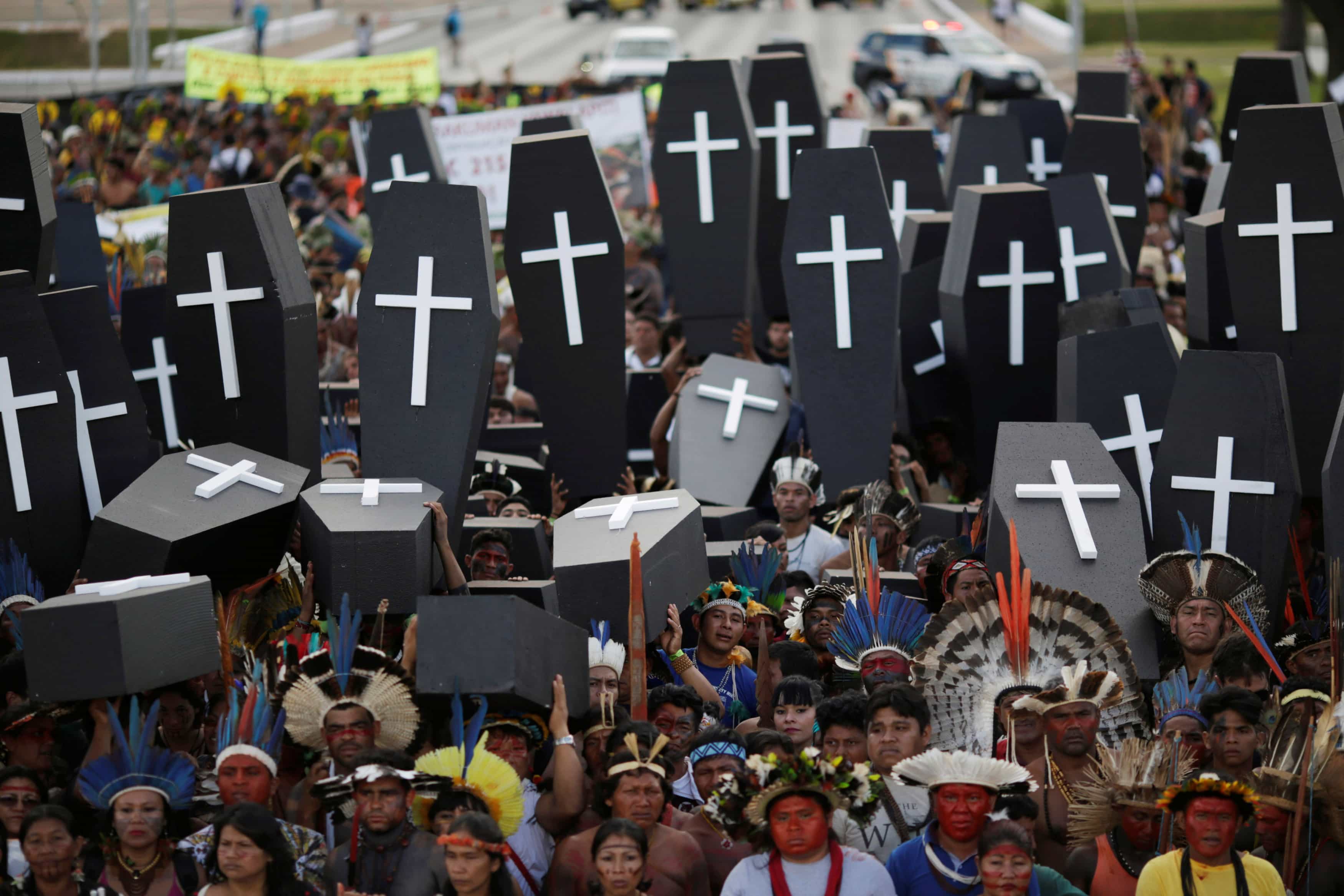 Brazilian Indians take part in a demonstration against the violation of indigenous people's rights, in Brasilia