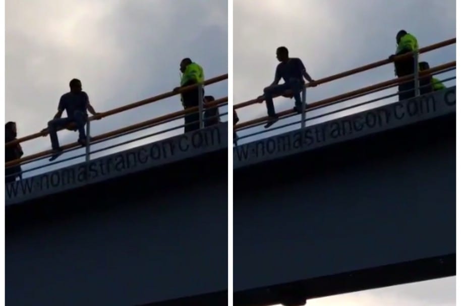 Policía evitar que hombre se lance de puente en Bogotá. Pulzo.com