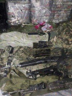 Dinero y armas recuperadas