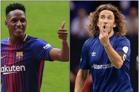 Yerry Mina y Carles Puyol