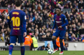 Yerry Mina y Lionel Messi