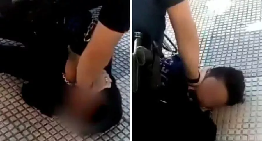 Policía deteniendo a joven de 14 años por no usar tapabocas en Burgos, España.