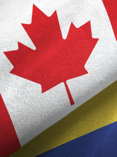 Banderas de Colombia y Canadá para ilustrar nota sobre requisitos para que los colombianos viajen a Canadá