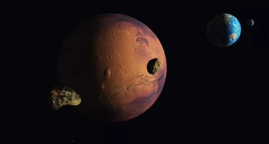 Composición de Marte y la Tierra, que estarán en su punto más cercano la primera semana de octubre.