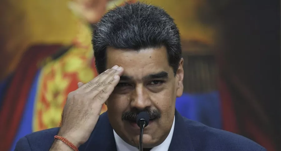 Nicolás Maduro, cuyo régimen es acusado por la OEA de envalentonarse ante la lentitud de las investigaciones de la CPI, hace un gesto durante una conferencia de prensa en el palacio de Miraflores, en Caracas, el 14 de febrero de 2020.
