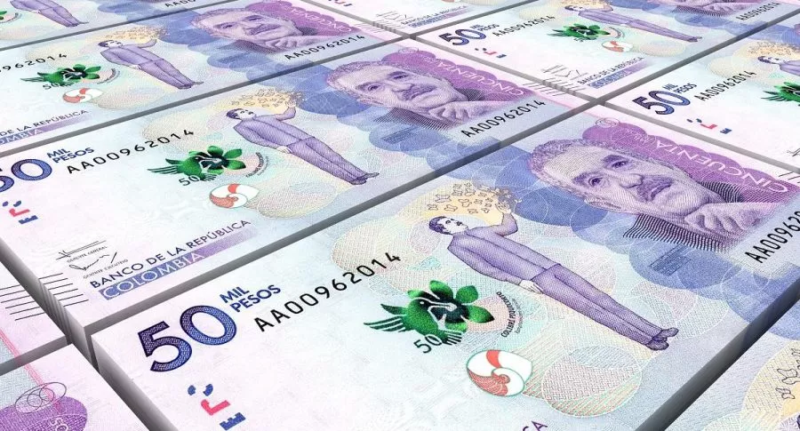 Imagen de billetes de 50 mil pesos colombianos, ilustra nota sobre un grupo de ladrones que se robó $ 2.300 millones de una casa en Medellín.