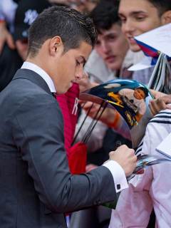 ZURICH, SWITZERLAND - JANUARY 12: James Rodriguez of Colombia and Real Madrid signs autographs prior to the FIFA Ballon d'Or Gala 2014 at the Kongresshaus on January 12, 2015 in Zurich, Switzerland. (Photo by Philipp Schmidli/Getty Images)