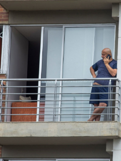 A man on his balcony while carrying out the disinfection campaign in special care areas and an awareness day in the Mazuren neighborhood, in the north of the city of Bogota, Colombia, on May 15, 2020 an area that is on orange alert for corona virus, Covid 19. With in order to protect the most vulnerable populations against this virus. (Photo by Daniel Garzon Herazo/NurPhoto via Getty Images)