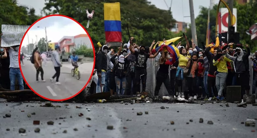 Imagen de mamá sacando a su hijo de protestas y de manifestantes en Colombia
