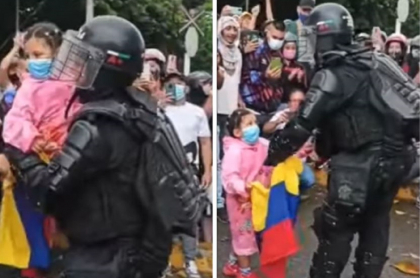 Video de niña entregándole la bandera de Colombia y abrazando a agente del Esmad durante manifestaciones en Buga, Valle del Cauca. 