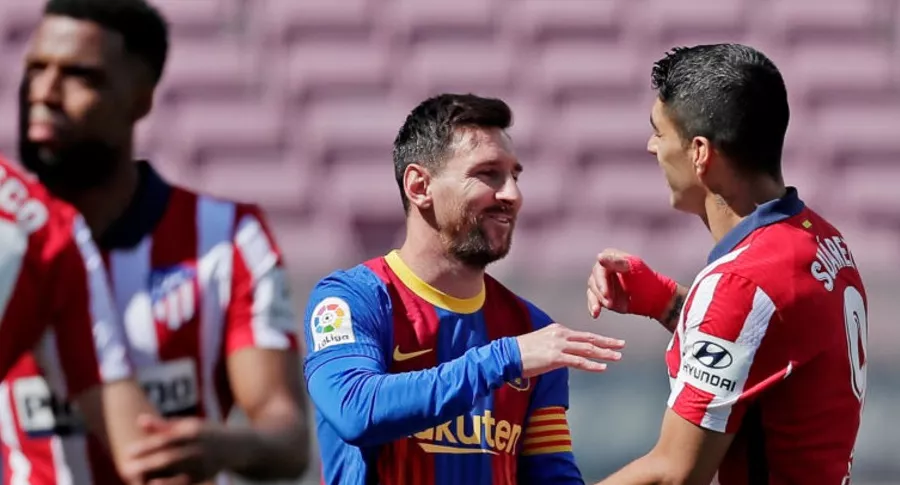 Lionel Messi y Luis Suárez, quienes fueron 'cazados' a la salida de un restaurante en Madrid