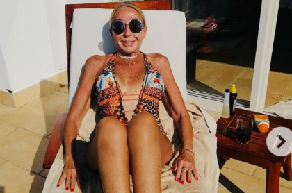 Laura Bozzo, tomando el sol en vestido de baño, tendría que pagar cerca de un millón de dólares para ni ir a prisión