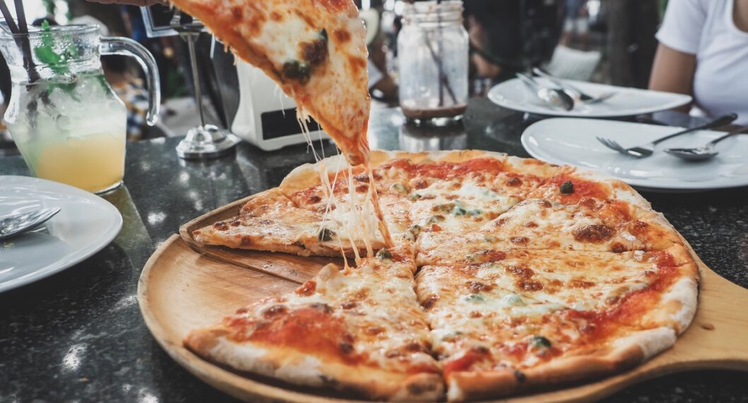 Pizza, cheese and peas are stretched.