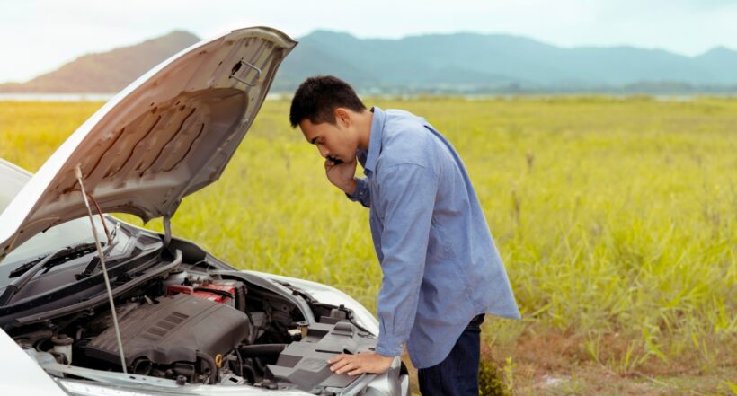 Problem Car of male calling maintenance service assistance emergency between road trip journey in mountain lake river for examining and repair system engine fixing, Transportation travel lifestyle