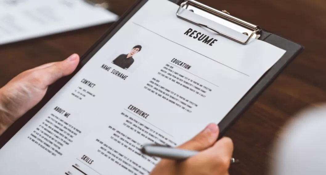 Businesswoman submits resume employer to review job application information on the desk, presents the ability for the company to agree with the position of the job.