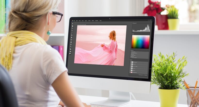 Graphic design artist editing photo on computer