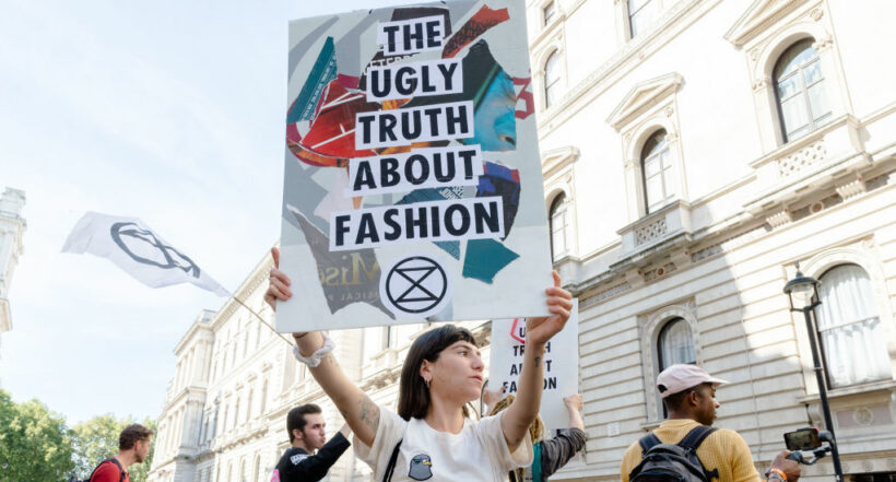 LONDON, UNITED KINGDOM - SEPTEMBER 15: Extinction Rebellion activists demonstrate outside the Foreign Office ahead of Victoria Beckham's show at the London Fashion Week on 15 September, 2019 in London, England. Protesters call for the British Fashion Council to cancel London Fashion Week until it can be sustainable in the face of climate crisis and ecological emergency. (Photo credit should read Wiktor Szymanowicz/Future Publishing via Getty Images)