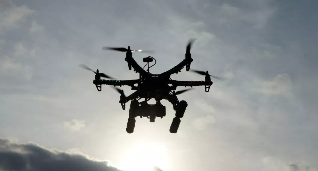 Hexacopter taking aerial photos at sunset. Also known as a drone or UAV (Unmanned Aerial Vehicle).