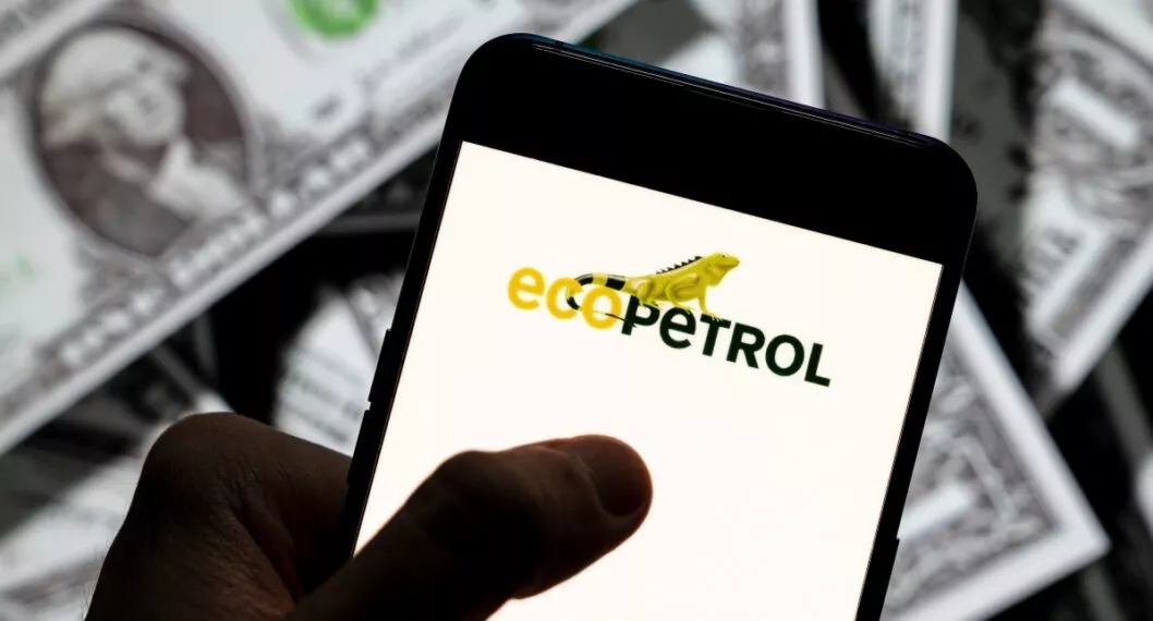 CHINA - 2021/04/23: In this photo illustration the Colombian oil and gas company Ecopetrol logo seen displayed on a smartphone with USD (United States dollar) currency in the background. (Photo Illustration by Budrul Chukrut/SOPA Images/LightRocket via Getty Images)