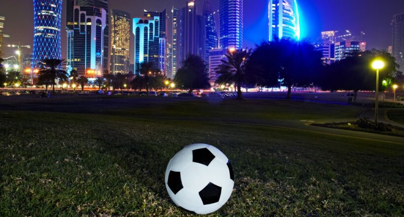 Football and skyline of the West Bay Doha. Qatar is set to stage the 2022 world cup football tournement, the first Middle east country to do so