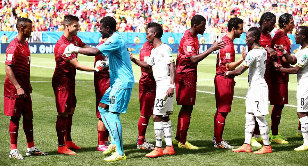 Jugadores de Portugal y Ghana en su partido de Brasil 2014.