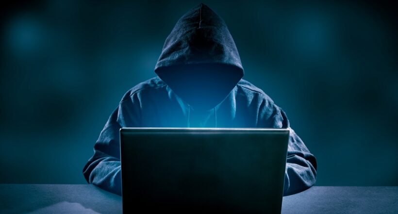 Hacker using laptop. Hacking the Internet.