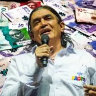 Gustavo Bolívar, que no quedó tan contento con aumento del salario mínimo 2023 con subsidio de transporte, en foto sobre billetes de Colombia.