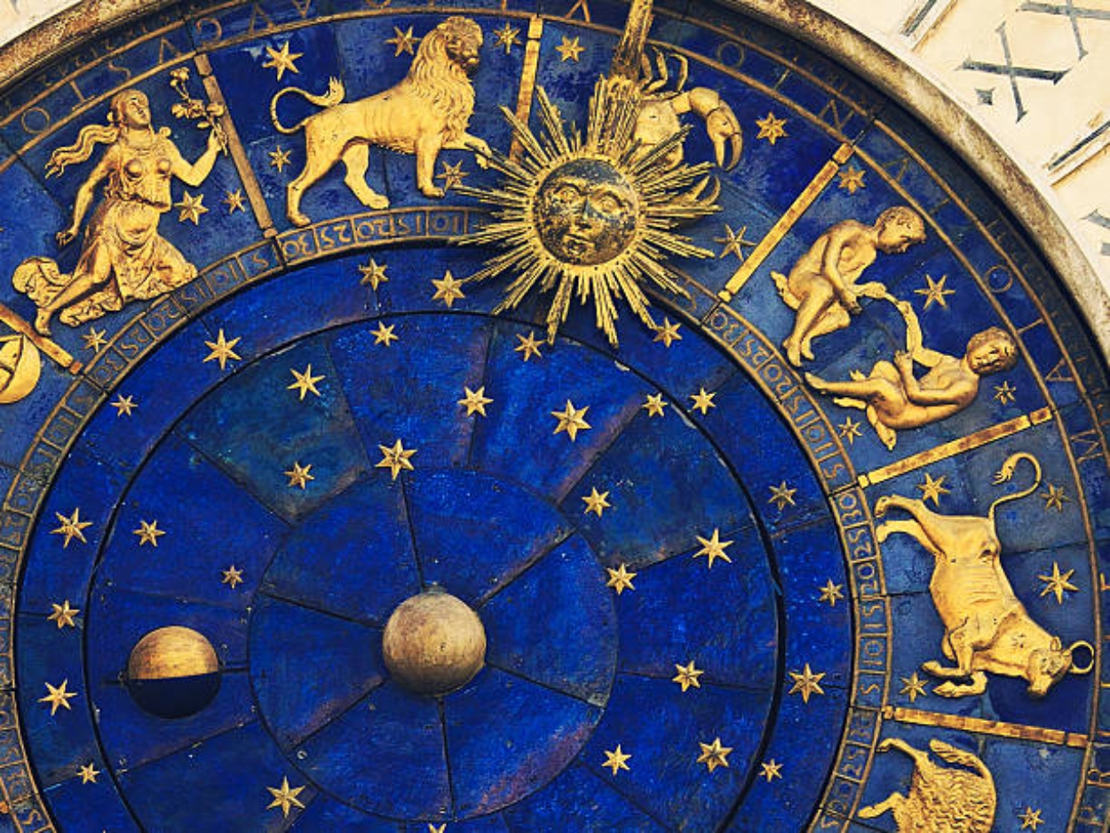 top rigth part face of the famous venetian clock -  Torre dell'Orologio on St Mark's Square (Piazza San Marco), showing the some signs of the zodiac (virgo, leo, cancer, gemini, taurus