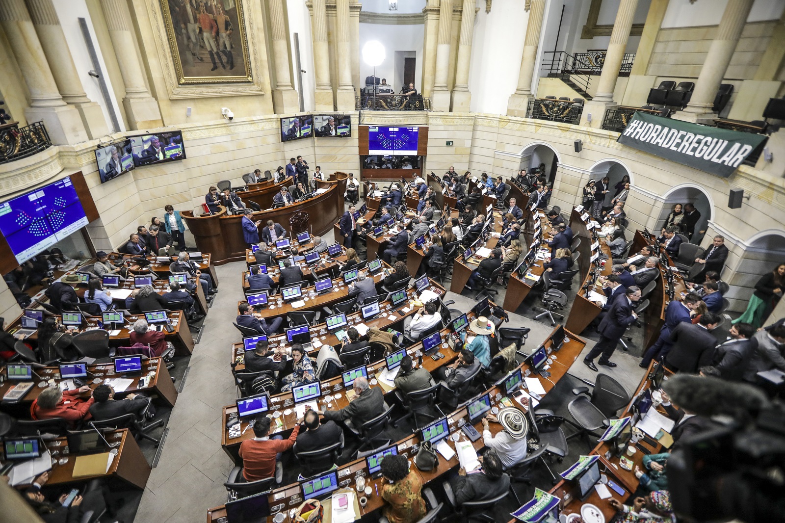 A general view shows the Colombian Senate during the debate on the recreational use of marijuana for adults, in the plenary hall of the congress of the republic at Bogota, on June 20, 2023. The Colombian Congress is discussing a constitutional reform that seeks to legalize the production and commercialization of cannabis for adults. (Photo by Juan Pablo Pino / AFP)