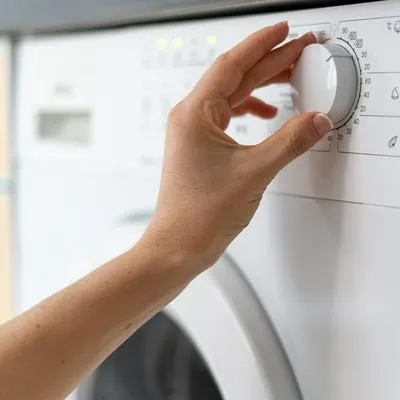Botón de la lavadora para secar la ropa más rápido
