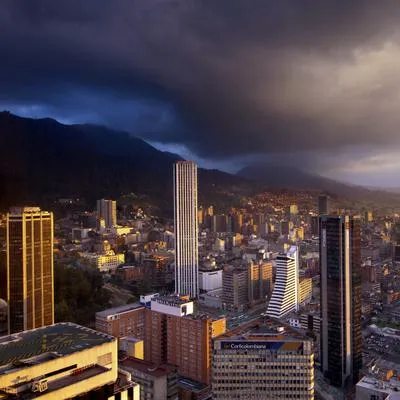 High rise office buildings of downtown Bogota at sunset looking south with the Andes Mountains rising to the east.