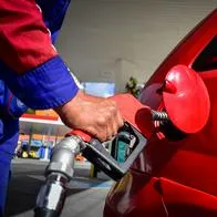 A fuel station worker fills a car with few fuel amid massive fuel shortages due to the increase of protests in Colombia against police brutality and abuse cases that rise to 16 women abused and more than 40 dead in the last 20 days of Anti-government National Strike, in Pasto, Narino on May 16, 2021. (Photo by: Camilo Erasso/Long Visual Press/Universal Images Group via Getty Images)