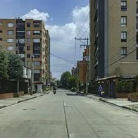 Bogota, Colombia - March 28, 2020: A carrera, in the Colombian capital city of Bogota. The section normally has a continuous flow of traffic at this time of the day. Today it is deserted due to the declared Coronavirus lockdown by the Government in the Country. Only people with needs that can be proven are allowed to step outside. Driver's Point of View. Horizontal Format.