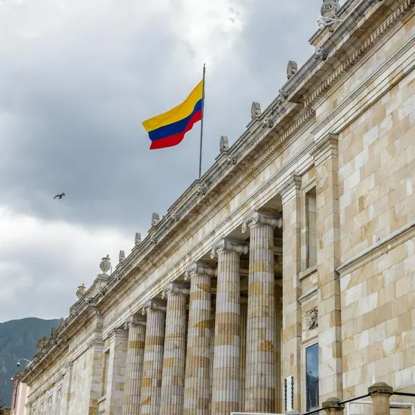 Colombian flag flies on the National Capitol building in Bogota