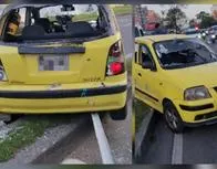 Taxista no se unió a paro en Bogotá por llevar a esposa al hospital y colegas le rompieron los vidrios del carro