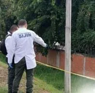 Investigadores en escena del crimen. En relación con hallazgo de conductor desaparecido.