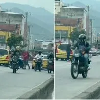 Taxis y motos por el carril del MIO huyendo de un guarda de tránsito en el centro de Cali