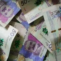 Foto de billetes colombianos, a propósito de incremento de salario mínimo de 13 %