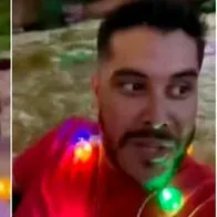 Dos hombres navegaron por el río Cali para ver los alumbrados.