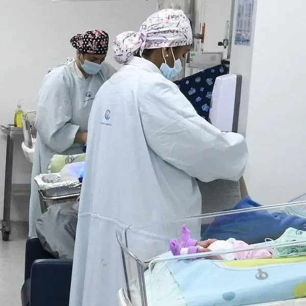 New born babies are pictured at a maternity room at the Versalles Clinic in Cali, Colombia, on October 21, 2022 (Photo by JOAQUIN SARMIENTO / AFP)